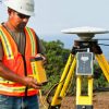 Construction Worker on Site Using Trimble Technology for Site Positioning