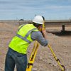 Construction Worker on Site Using Trimble Total Station